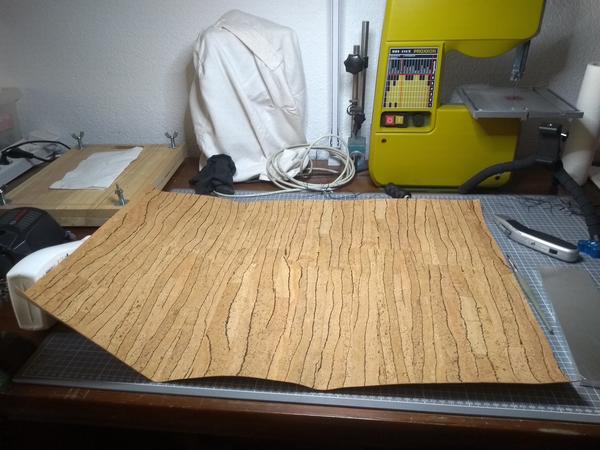 A sheet of cork, covering a table.