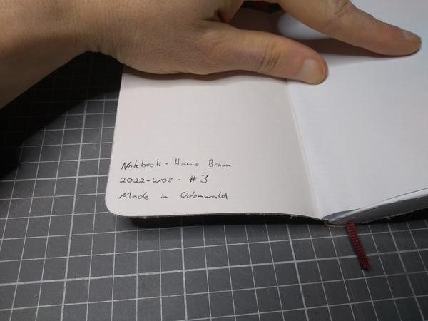The notebook, showing the following signature on the inside of the cover: Notebook · Hanno Braun · 2022-W08 · #3 · Made in Odenwald