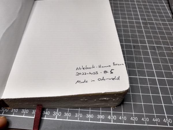 The notebook, showing the following signature on the inside of the cover: Notebook · Hanno Braun · 2022-W23 · #5 · Made in Odenwald