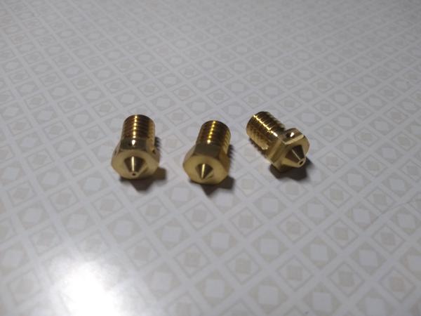 Three brass nozzles made by E3D; 0.25mm, 0.6mm, and 0.8mm nozzle diameter.