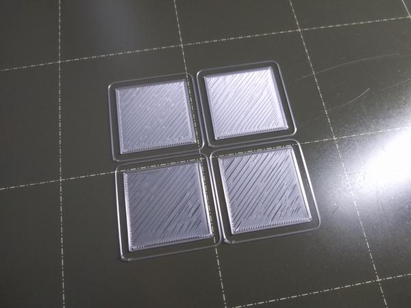 Four rectangular test prints with only one layer, showing gaps between the extrusions.