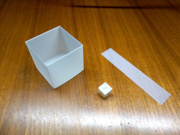 A small calibration cube, a larger cube printed in vase mode, and a one-layer calibration square. All printed in NonOilen.